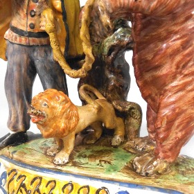 detail of a staffordshire performing bear group, how the mighty have fallen